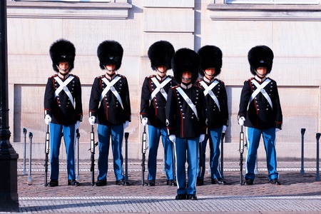 Royal Guards during the ceremony of changing the guards on the square at Amalienborg Castle,...
