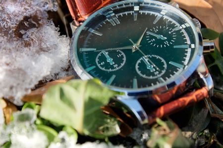 Luxury and modern Wristwatch in Snowの写真素材