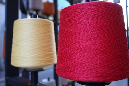 Reels or spools of multicolored sewing threads. Threads of all colors.