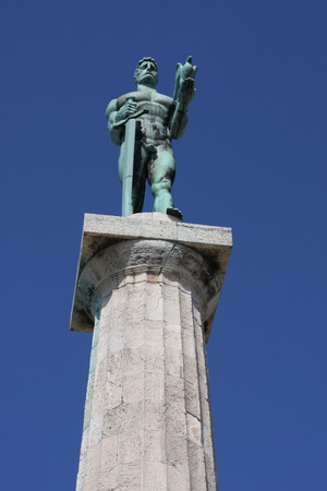 Monument sculpture of the Belgrade Victor made of bronze, located in Kalemegdan park facing the Sava River and Zemun district, Belgrade, Serbia.の写真素材