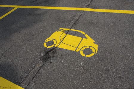 parking spot with a yellow car painted.の写真素材