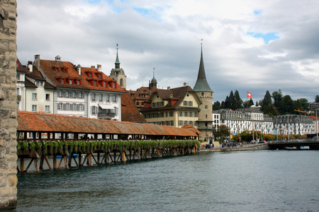Famous Chapel bridge in Lucerne in a beautiful summer day, Switzerlandのeditorial素材