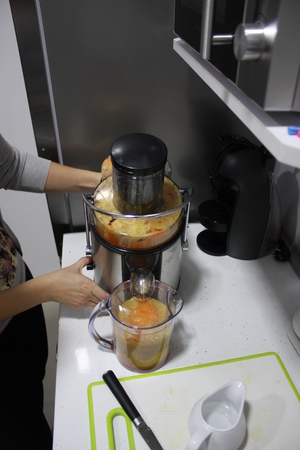 making a juice in machineの写真素材
