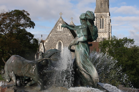 View of famous Gefion Fountain (Gefionspringvandet 1899) in Copenhagen. Gefion Fountain depicting legendary Norse goddess driving four oxen. It was designed by Danish artist Anders Bundgaard. Denmark.の写真素材