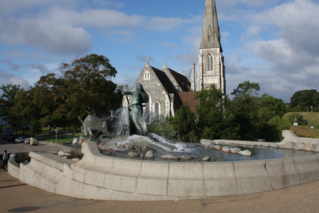 View of famous Gefion Fountain (Gefionspringvandet 1899) in Copenhagen. Gefion Fountain depicting legendary Norse goddess driving four oxen. It was designed by Danish artist Anders Bundgaard. Denmark.の写真素材