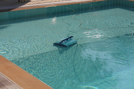 Robot working and cleaning inside swimming poolの写真素材