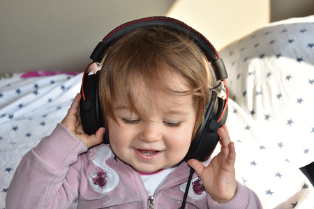 baby with headphone. young DJの写真素材
