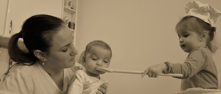 Family cooking in kitchen at homeの写真素材