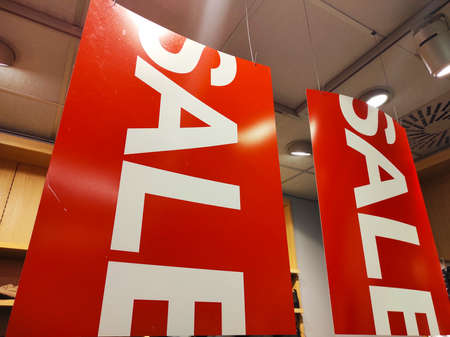 Sale signs in a clothing store.の写真素材