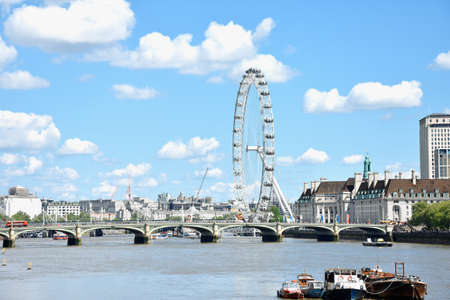 The London Eye on the South Bank of the River Thames at night in London, Englandのeditorial素材