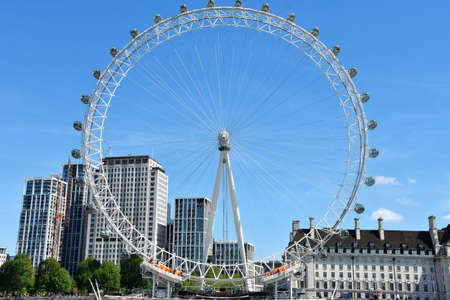 The London Eye on the South Bank of the River Thames at night in London, Englandのeditorial素材