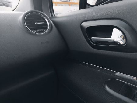 Interior of a modern car. Close-up of the door handle.の写真素材