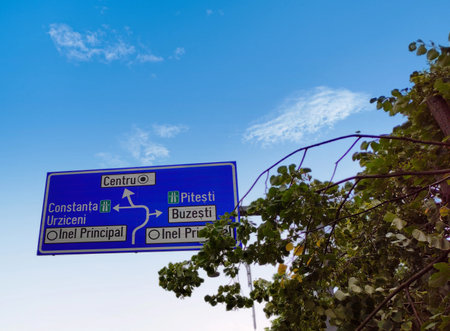 Road sign with blue sky and white cloudsの写真素材