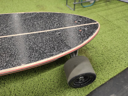 skateboard on green carpet in skate park, closeup of photoの写真素材