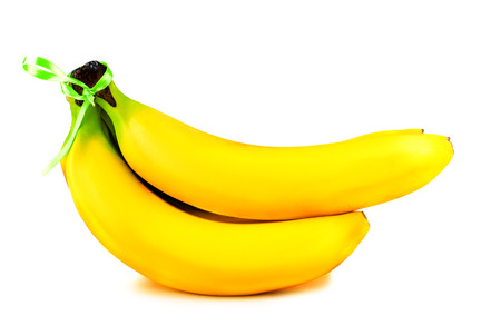 Bunch or hand of bananas on a white studio background の写真素材