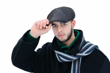 man in black coat and a hat on his head during winterの写真素材