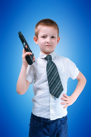boy in a white shirt and tie with armsの写真素材