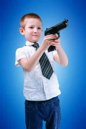 boy in a white shirt and tie with armsの写真素材