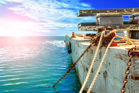 old abandoned pier on the background of blue skyの写真素材