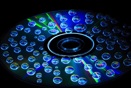 colorful water drops on CD DVD discの写真素材