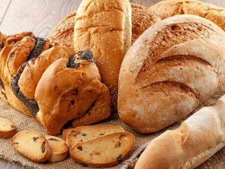 Composition of bread close-up on a wooden background.