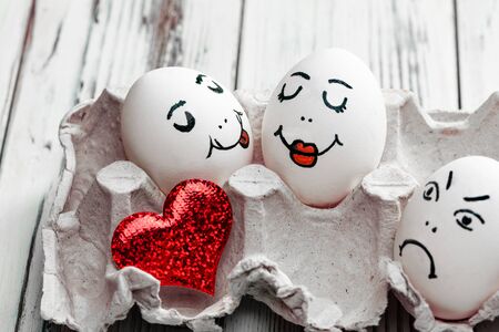 Colored chicken emoticons on a love theme with a red heartの写真素材