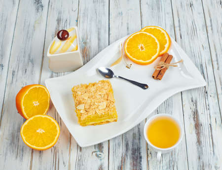 Hot tea with a mug spoon oops orange slices and sugar. Cozy home tea conceptの写真素材