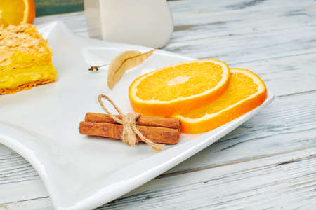 Hot tea with a mug spoon oops orange slices and sugar. Cozy home tea conceptの写真素材