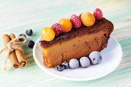 delicious homemade cakes with wild berries on a white wooden table