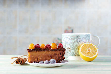 delicious homemade cakes with wild berries on a white wooden tableの写真素材