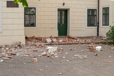 Zagreb, Croatia-April 6th,2020: Collapsed building parts, lying on the floor in the garden, after being broken off during heavy earthquakeのeditorial素材