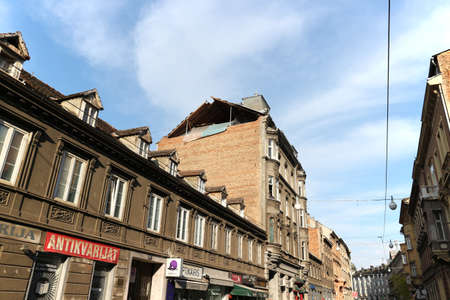 Zagreb, Croatia-April 26th, 2020: Collapsed brick wall and ruined roof on the old house, damaged after strong earthquake in the city centerのeditorial素材