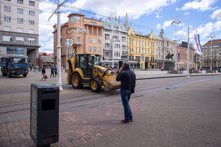 Zagreb,Croatia-May 2nd, 2020: Working vehicles on the main Zagreb city square, cleaning and removing earthquake debris and broken off building parts as Croatia eases restrictive corona virus measuresのeditorial素材