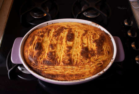 Home made mediterranean version of "shepperd`s pie", made with turkey, meat, zucchini, mushrooms, carrots, onions, tomato and covered with mashed potato mixed with cottage cheese, dill and spicesの写真素材