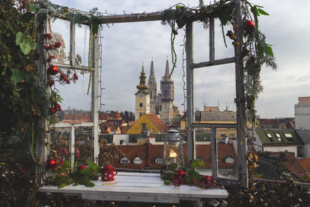 Zagreb, Croatia-December 13th, 2020: Beautiful Zagreb Advent decorations, such as open window with view over city rooftops and wonderful gothic cathedral, damaged in this year earthquakeのeditorial素材