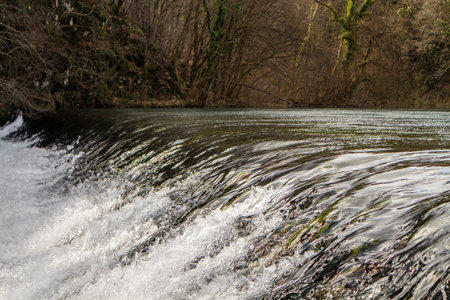 Crystal clear mountain river Slunjcica, falling over cascade, deep in the mountain forest near Rastoke village, Croatiaの写真素材