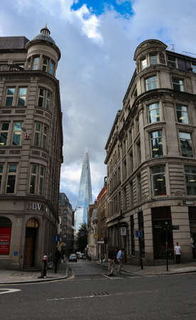 London, England -August 9th, 2018: Shard, popular London city landmark rising high above the city, reflecting the sky in the glassのeditorial素材