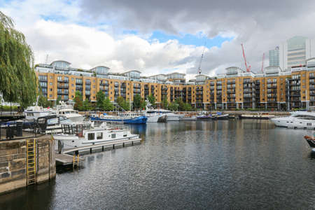 London, England -August 9th, 2018: St. Katharine Docks Marina, wonderful part of the London city situated in the calm marina with anchored ships by the Thames riverのeditorial素材