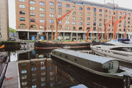London, England -August 9th, 2018: Anchored boats from modern to classic in the St. Katharine Dock Marina, Londonのeditorial素材