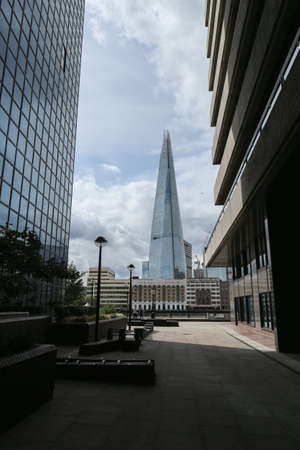 London, England -August 10th, 2018: Iconic skyscraper Shard rising high above London city waterfrontのeditorial素材