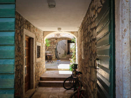 Beautiful, old, closed yard within the old town centre at Tisno, on Murter island, Croatiaの写真素材