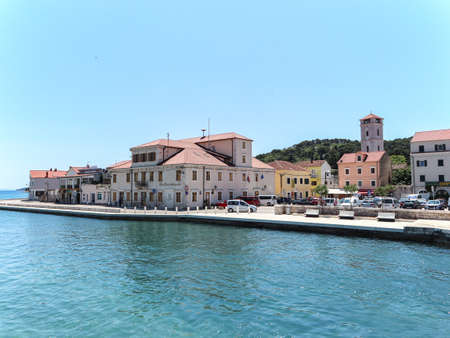 Tisno, Croatia-June 3rd, 2021: Beautiful small town of Tisno with its mediterranean architecture, located on famous Murter island in central Dalmatiaのeditorial素材