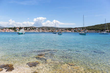 Rogoznica, Croatia-July 06th, 2021: Sailing boats anchored in the wonderful, shallow, turquoise bay of Rogoznica, Croatia, popular tourist and nautical destinationのeditorial素材
