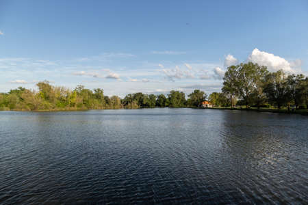 Beautiful Savica fishing pond, near the center of Zagreb city, nesting place for many birds and relaxing destination for fishermenの写真素材