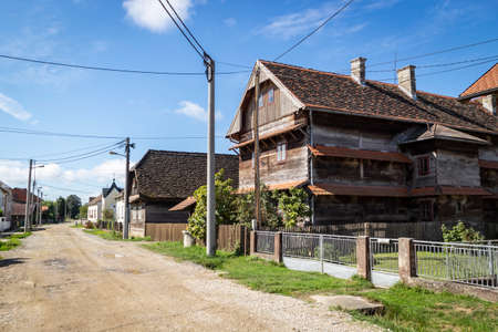 Kuce, Croatia-August 6th, 2021: Old, traditional wooden school in the village of Kuce, on the edge of Turopolje forest, monument of traditional croatian architecture in continental regionsのeditorial素材