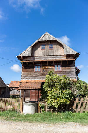 Kuce, Croatia-August 6th, 2021: Old, traditional wooden school in the village of Kuce, on the edge of Turopolje forest, monument of traditional croatian architecture in continental regionsのeditorial素材