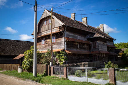 Kuce, Croatia-August 6th, 2021: Old, traditional wooden school in the village of Kuce, on the edge of Turopolje forest, monument of traditional croatian architecture in continental regionsのeditorial素材