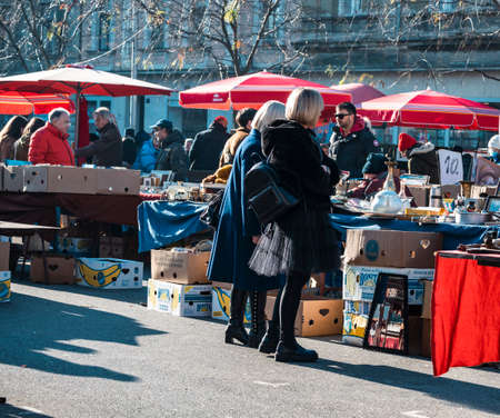 Zagreb, Croatia-December 19th, 2021: People buying and watching old, vintage items at the Britanac square in Zagreb city, Croatia, popular flea market during every sunday in the weekのeditorial素材