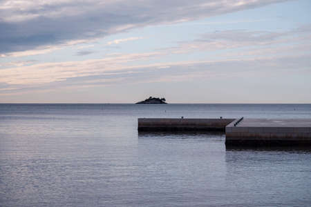 Peaceful, winter sunset over Monte Mullini beach at the popular tourist destination of Rovinj, Croatiaのeditorial素材