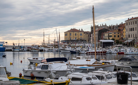 Rovinj, Croatia-January 6th, 2022: Crowded Rovinj city port with dozens of anchored boats and ships during winter sunsetのeditorial素材